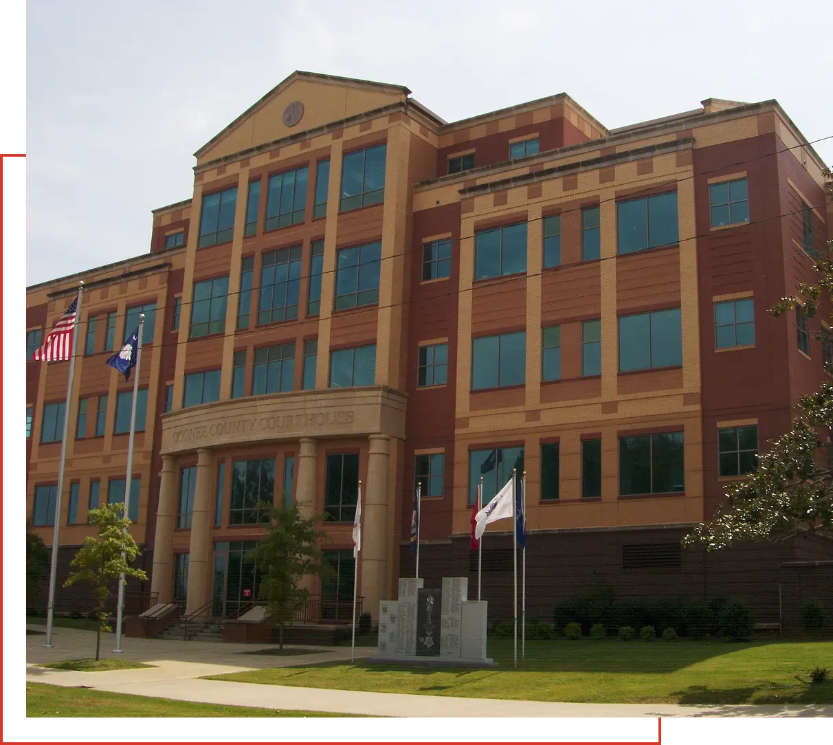 Red brick municipal building with flags